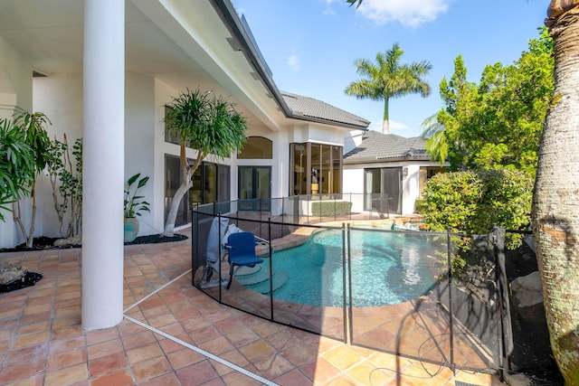 view of pool featuring a patio area and a fenced in pool