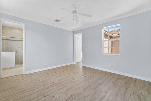 unfurnished bedroom featuring ornamental molding, visible vents, baseboards, and wood finished floors
