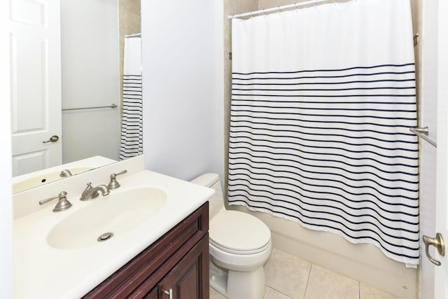 bathroom featuring vanity, shower / bath combo with shower curtain, tile patterned flooring, and toilet