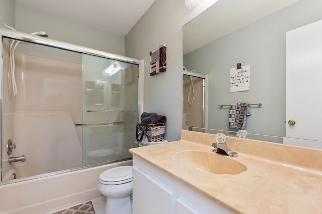 full bath featuring shower / bath combination with glass door, vanity, and toilet