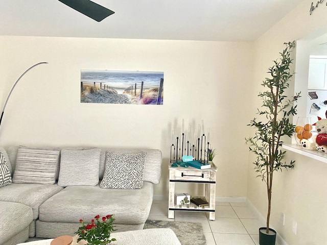 tiled living area with baseboards