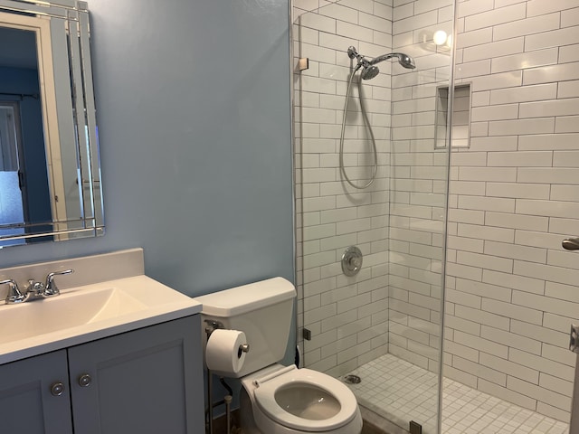 full bathroom featuring vanity, toilet, and a stall shower