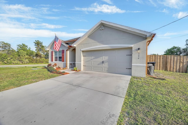 ranch-style home with a garage, fence, a front lawn, and stucco siding