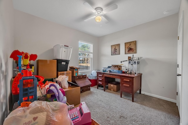 office area with ceiling fan, carpet floors, and baseboards