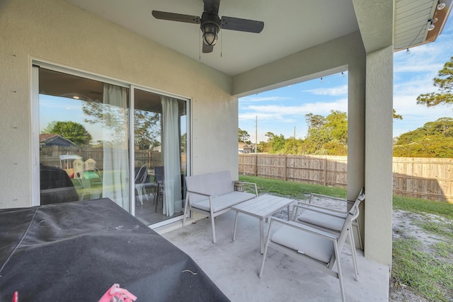 view of patio with fence private yard and ceiling fan