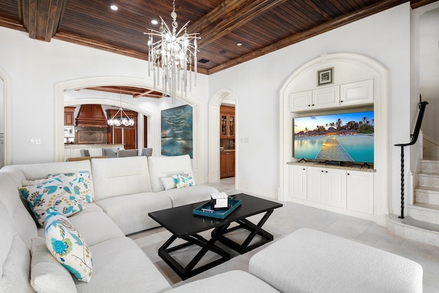 living area featuring arched walkways, wooden ceiling, a notable chandelier, stairs, and beam ceiling