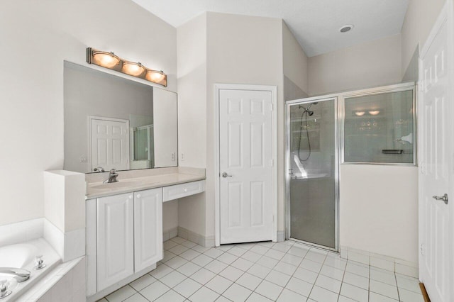 full bathroom with a stall shower, vanity, a bath, and tile patterned floors