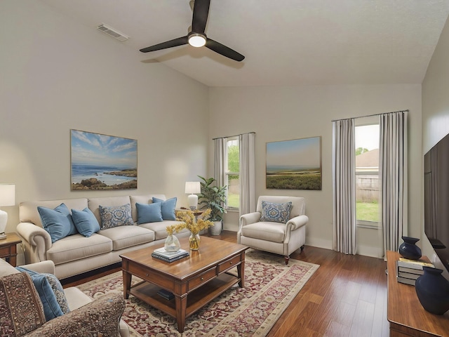 living room with lofted ceiling, visible vents, plenty of natural light, and wood finished floors