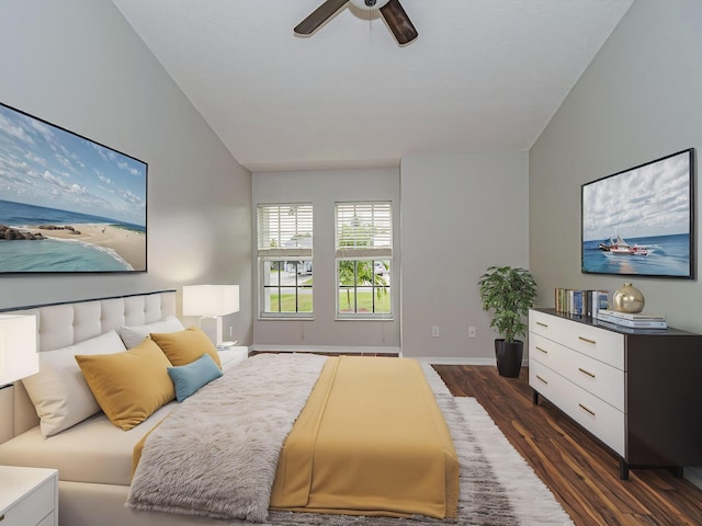 bedroom with ceiling fan, baseboards, vaulted ceiling, and dark wood finished floors