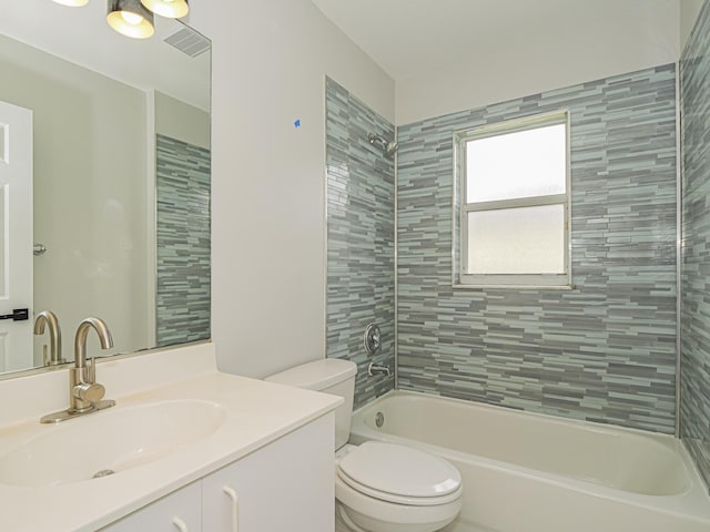 full bath featuring visible vents, vanity, shower / tub combination, and toilet