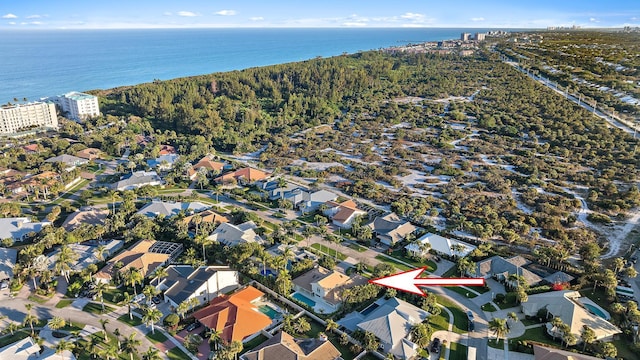 birds eye view of property featuring a water view and a residential view