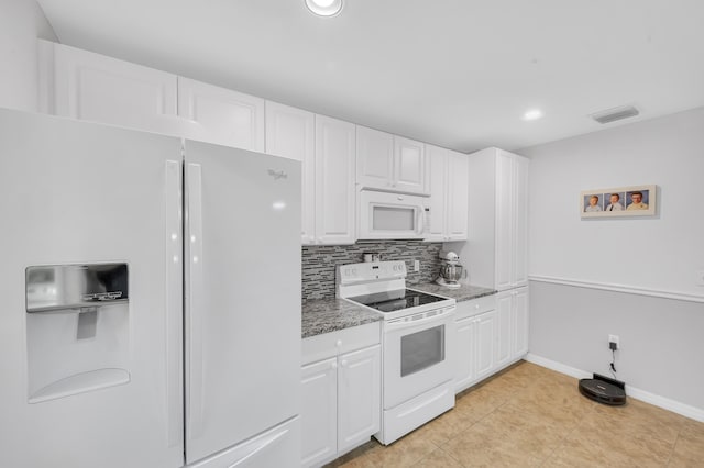 kitchen featuring white appliances, visible vents, backsplash, and white cabinets