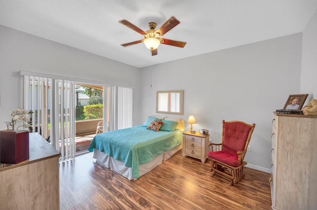 bedroom featuring access to exterior, baseboards, a ceiling fan, and wood finished floors