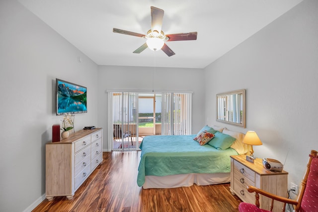 bedroom with baseboards, ceiling fan, wood finished floors, and access to exterior