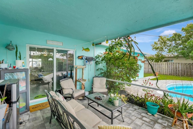 view of patio / terrace with fence and a fenced in pool