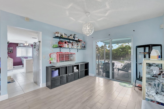 interior space featuring baseboards and wood finished floors