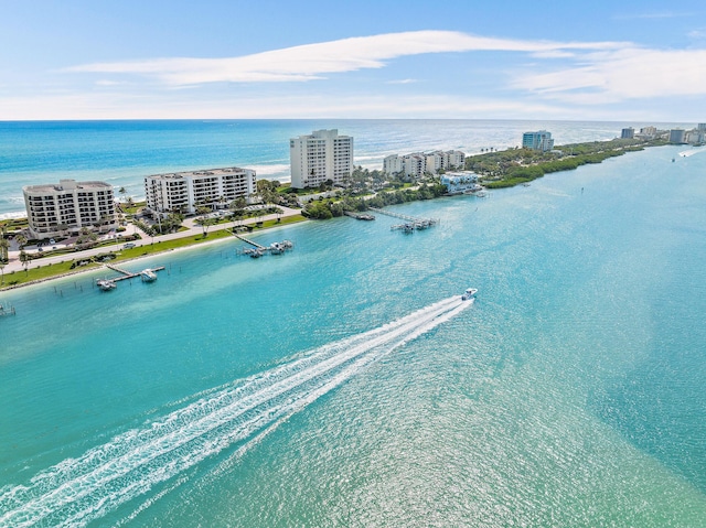 bird's eye view with a city view, a beach view, and a water view