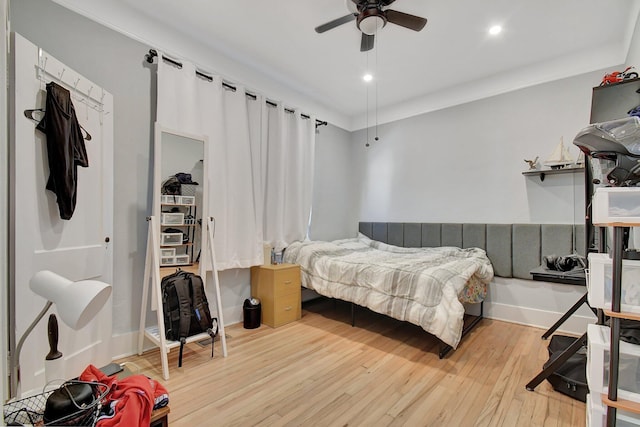 bedroom with a ceiling fan, recessed lighting, baseboards, and wood finished floors