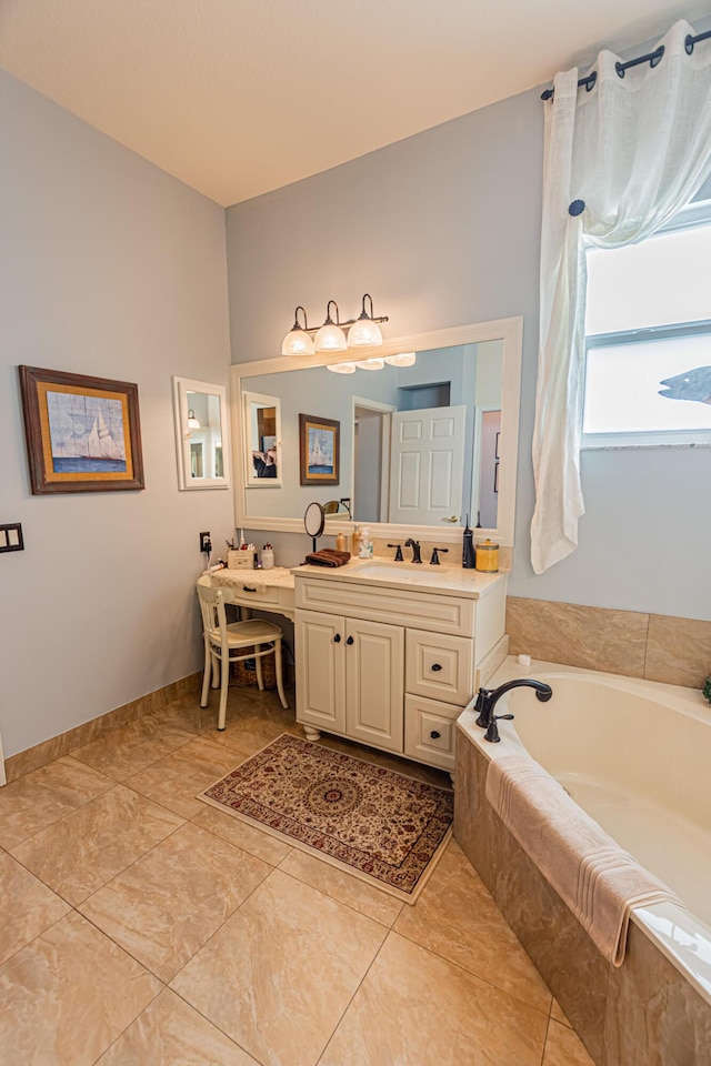 full bathroom featuring a garden tub, baseboards, and vanity