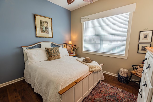 bedroom featuring dark wood-style floors and baseboards