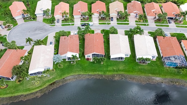 bird's eye view with a water view and a residential view