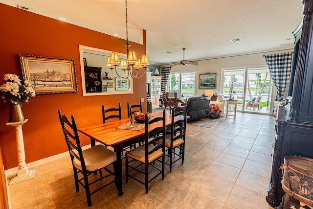 dining area with baseboards, visible vents, an inviting chandelier, and light tile patterned floors