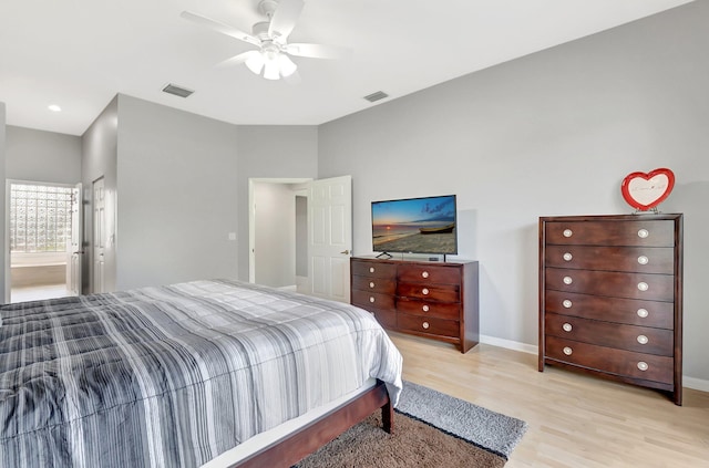 bedroom featuring light wood-type flooring, baseboards, visible vents, and a ceiling fan