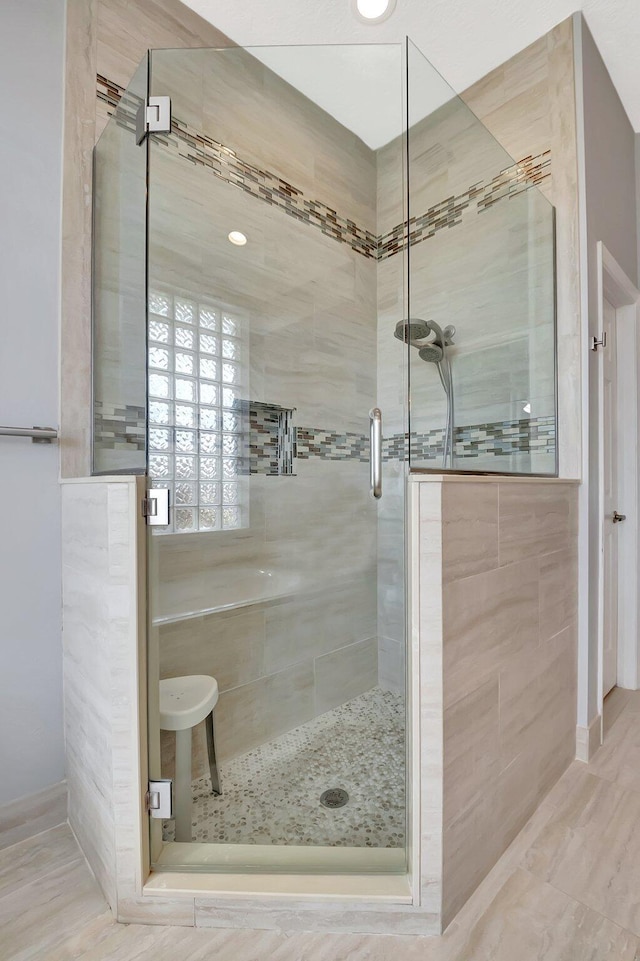 bathroom with a shower stall