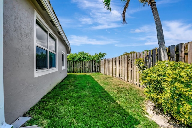 view of yard with a fenced backyard