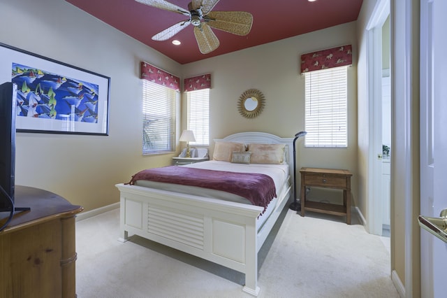 bedroom with multiple windows, carpet flooring, and baseboards