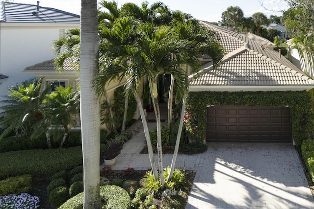 exterior space with driveway and a garage