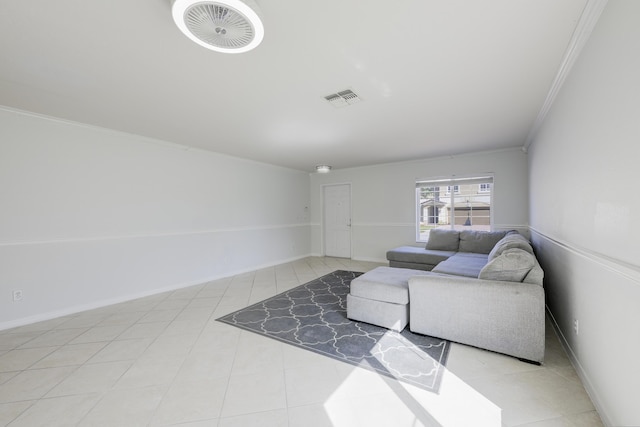 living room with ornamental molding, tile patterned flooring, visible vents, and baseboards