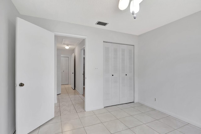 unfurnished bedroom featuring visible vents and a closet