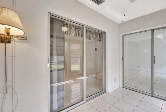 interior space featuring visible vents and light tile patterned floors