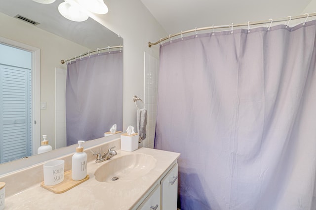 bathroom featuring visible vents and vanity