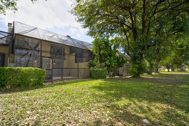 view of yard with a lanai