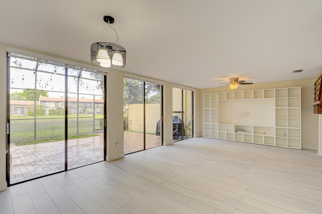 interior space featuring ceiling fan and visible vents