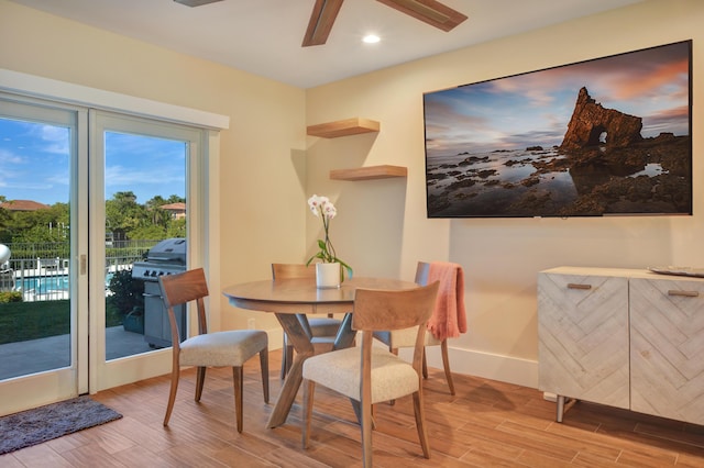 dining space with wood finish floors, ceiling fan, baseboards, and recessed lighting