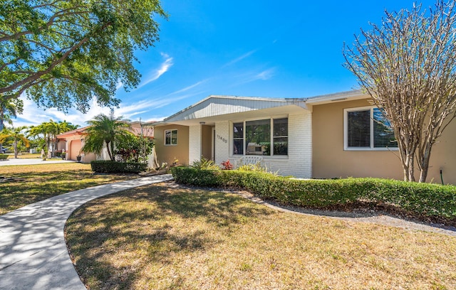 17400 SW 92nd Ct, Palmetto Bay, FL 33157 - ranch-style home featuring a front yard and brick siding
