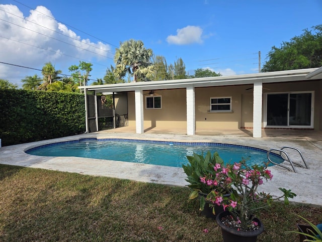 17400 SW 92nd Ct, Palmetto Bay, FL 33157 - rear view of house featuring a fenced in pool, fence, ceiling fan, and a patio area