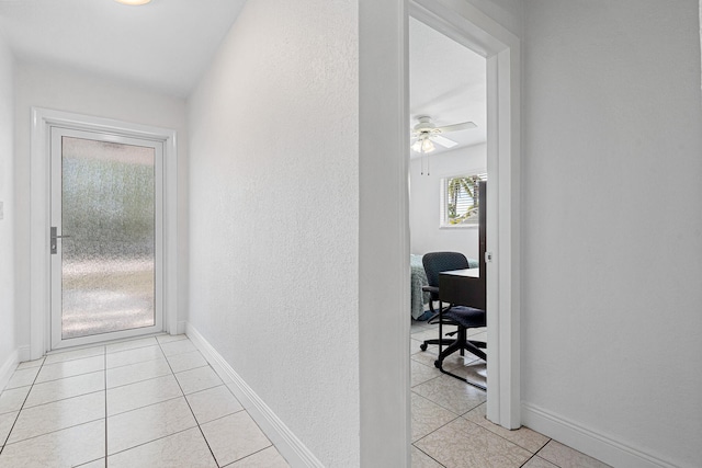17400 SW 92nd Ct, Palmetto Bay, FL 33157 - hall featuring baseboards, a textured wall, and light tile patterned floors