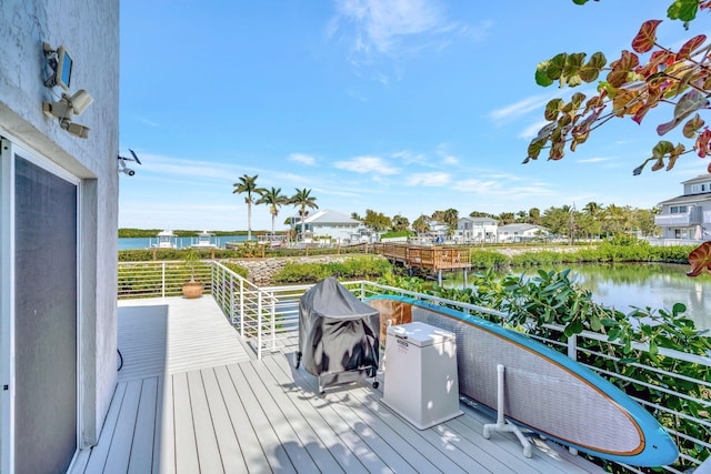 wooden deck with a water view