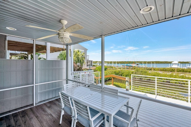 deck featuring a water view and ceiling fan