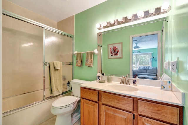 full bath featuring ceiling fan, connected bathroom, toilet, bath / shower combo with glass door, and vanity