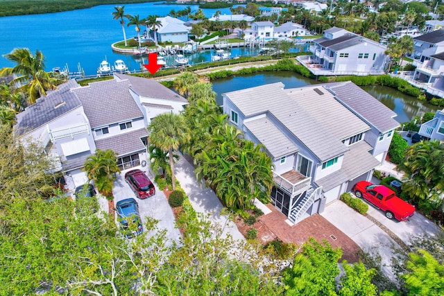 aerial view featuring a water view and a residential view