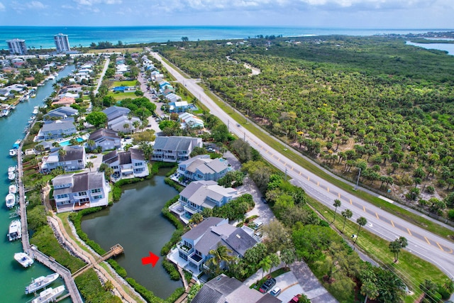 birds eye view of property featuring a water view