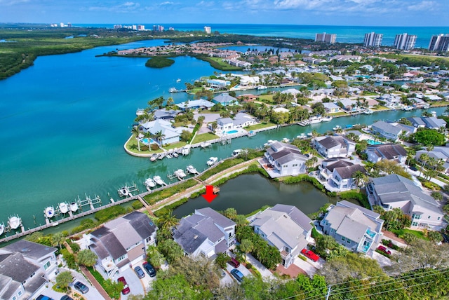 birds eye view of property with a residential view and a water view