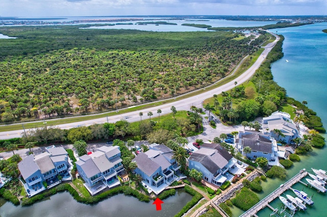 birds eye view of property featuring a residential view and a water view