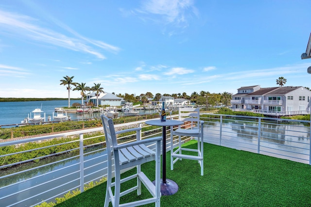 balcony featuring a water view