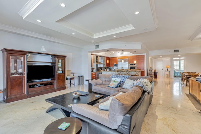 living area featuring visible vents, a raised ceiling, ornamental molding, marble finish floor, and recessed lighting